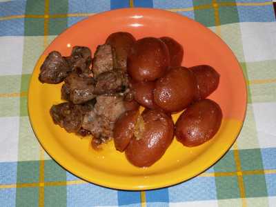 Baked potatoes with fried pork